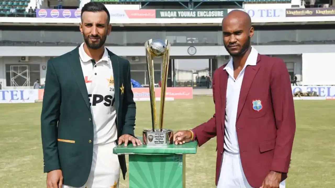 Shan Masood and Kraigg Brathwaite pose with the trophy